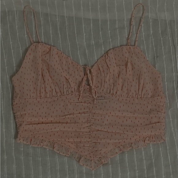 Light pink spotted tank top. Ruched mid section with adjustable straps and tie - Picture 2 of 5